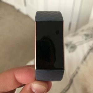 Fitbit charge 3- purple and rose gold